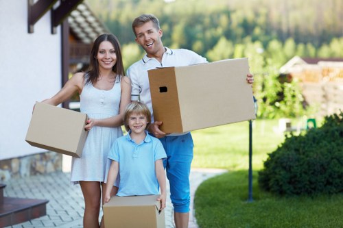 Professional movers loading household items for a local move